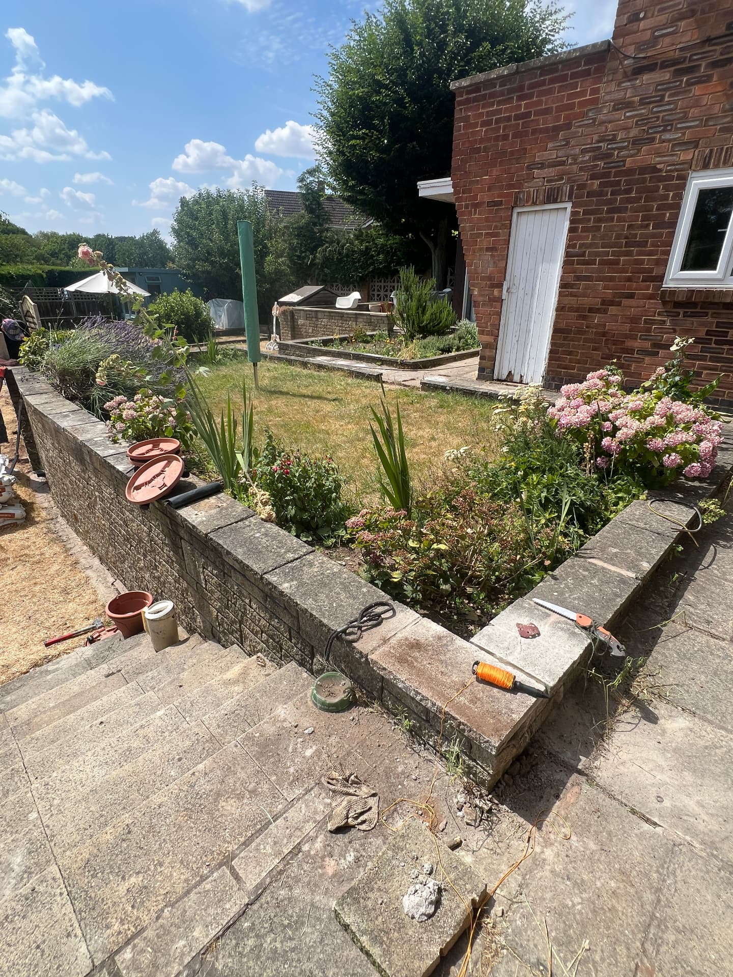 Raised garden bed and lawn before decorative timber fencing was installed